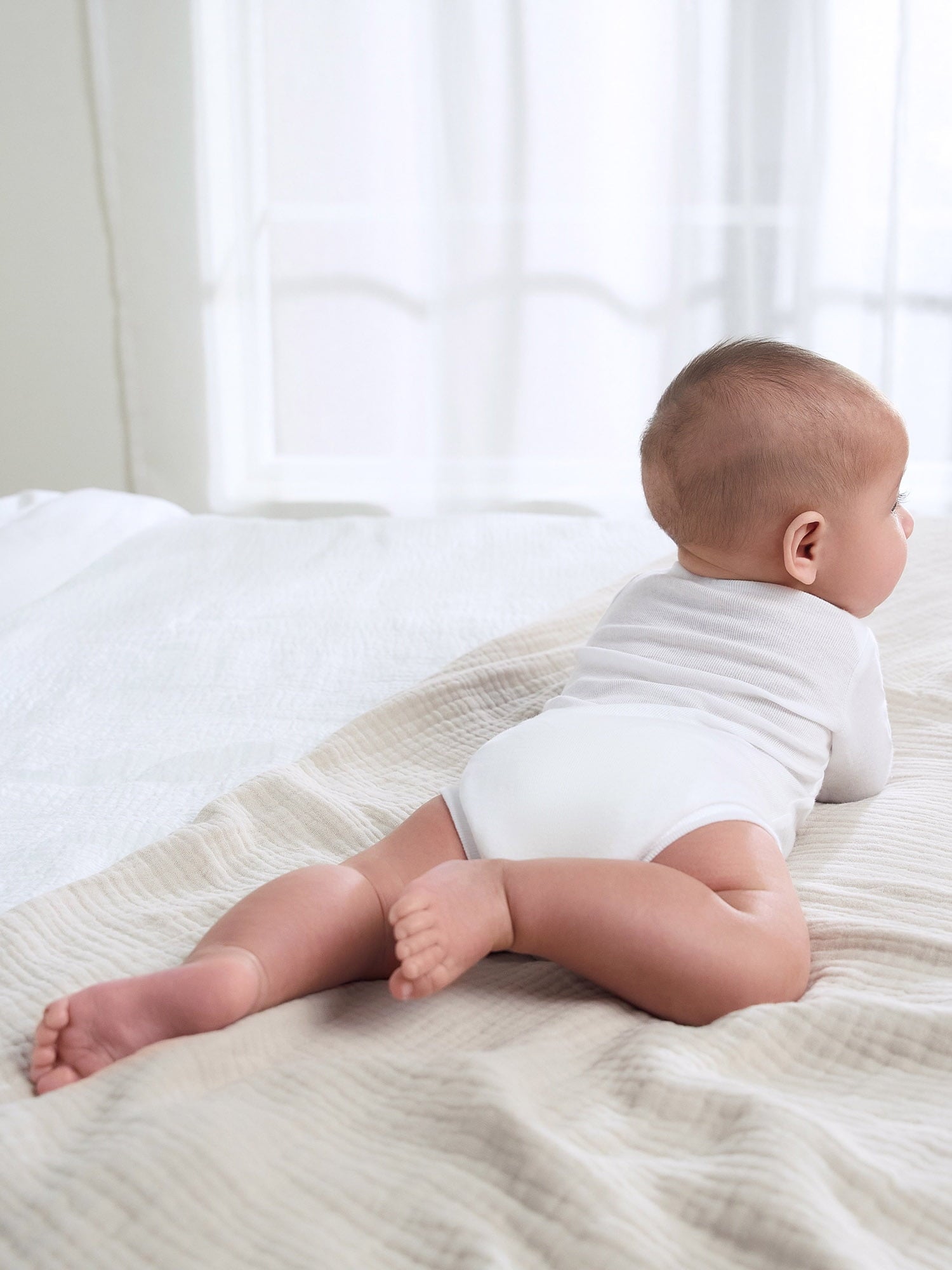 Gerber Gender Neutral Leisure White Long Sleeve Cotton Bodysuit, 3-Pack, Sizes Preemie - 24 Months